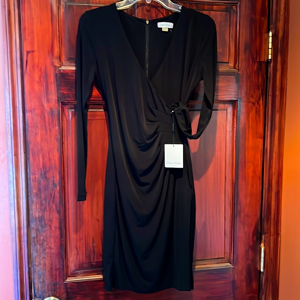 Womens Calvin Klein size 2, black, long  sleeve cocktail dress with tags.